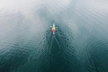 Two kayakers paddle along the Salish Sea off the coast of San Juan Island in Washington.