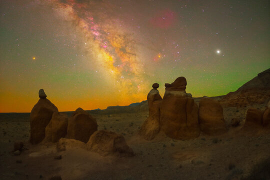 Three hoodoos sit under three planets (from left to right: Mars, Saturn, Jupiter) in the clear Utah night sky.