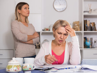 Mother and her adult daughter took on head from bad financial condition and lot of debts.