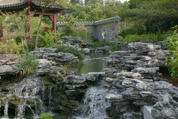 Fototapeta na wymiar Lake and Waterfall in Lingnan Garden, Hong Kong 27 Dec 2004