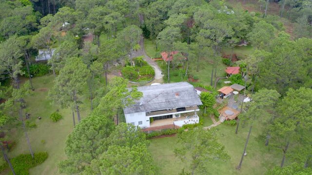 Vacation House Surrounded By Lush Green Mahogany Trees In Jarabacoa, La Vega Province, Dominican Republic. aerial