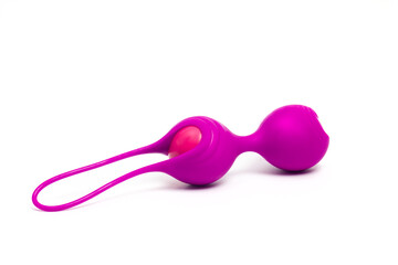 Pink Kegel balls on white background