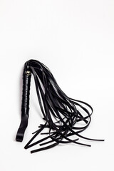 Leather whip on white background