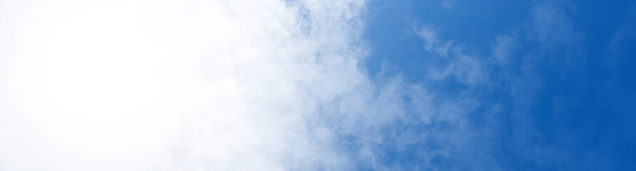 Blue sky background with white clouds. Panorama
