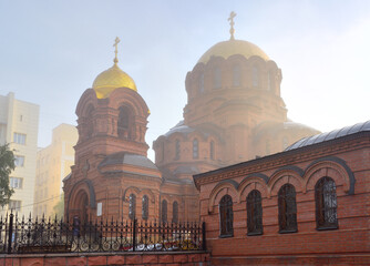 Fototapeta na wymiar Alexander Nevsky Cathedral in the fog in Novosibirsk