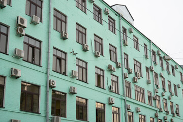 Naklejka premium green building facade in the city