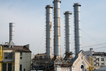 city ​​industrial pipes with buildings