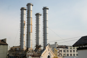 city ​​industrial pipes with buildings