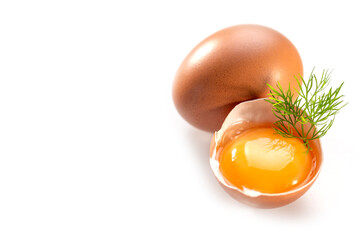 Raw chicken egg yolk in shell on white background