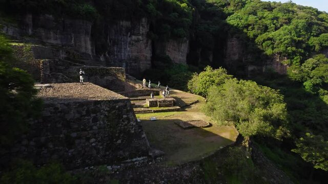 A troop of Mexican soldiers patrolling the old Aztec ruins located in the hillside above Malinalco, Mexico.  
the Pyramid in the jungle was a retreat for elite Aztec warriors.  Cinematic footage