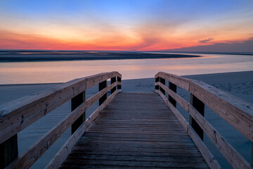 Fototapeta na wymiar Sunrise on the Boardwalk at Gould's Inlet Beach, St Simons Island, GA