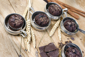 Chocolate muffin in rustic silver cup, chocolate muffin for enjoyment, sweet pleasure