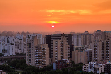 Beautiful sunset in Gurgaon,Haryana,India skyline during Covid 19 pandemic on September...