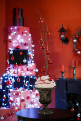 beautiful Christmas composition on the table against the background of a Christmas tree made of gift boxes