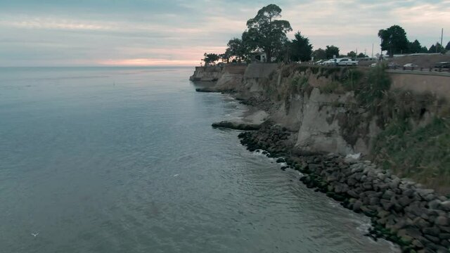 Aerial: Cliffs and calm Ocean in Capitola, Santa Cruz, USA