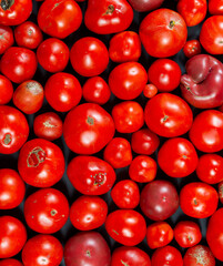 Background of red ripe tomatoes, top view. 