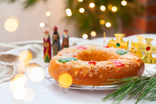 Traditional Spanish Epiphany cake, Roscon de Reyes with festive decorations 