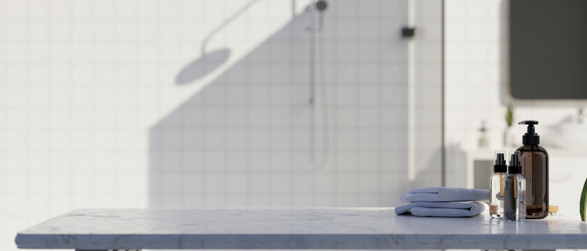 Marble Table Top Counter With Towels, Shower Gel Bottles And Mockup Space Over Minimalist White Bathroom