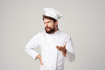 bearded man chef kitchen Job hand gestures light background