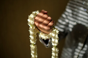 holding jasmine flower