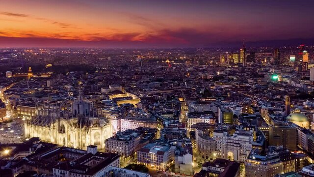 Milan Cathedral Hyperlapse Time lapse sunset. Duomo di Milano  Aerial Drone Flight Timelapse Of Panoramic Skyline Milano City life. People walking on Square during the fashion week. Drone lapse 4k