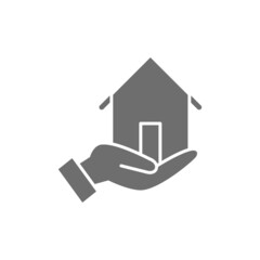Fototapeta na wymiar Hand holds house, home insurance, real estate protection grey icon.