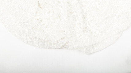 Tailoring. Clothing design. concept of tailoring wedding dresses. White guipure fabric background