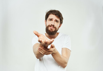 bearded man in a white t-shirt irritated facial expression Studio