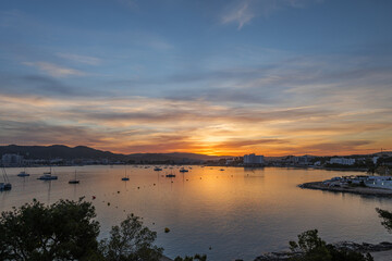 Fototapeta na wymiar Beautiful Sunrise in the port of Sant Antoni de Portmany, Ibiza, Balearic Islands, Spain.