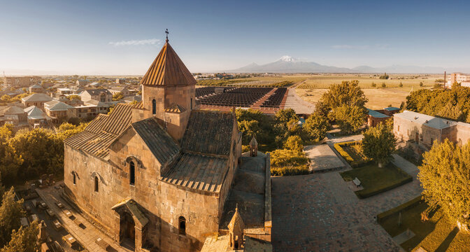 Aerial morning view of the famous Mountain Ararat and the church of St. Gayane in the foreground. Travel and tourist attractions in Armenia