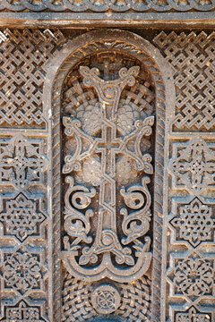Traditional carved khachkar or cross-stone made of pink tuff installed near Hovhannavank monastery. Armenian heritage and Art