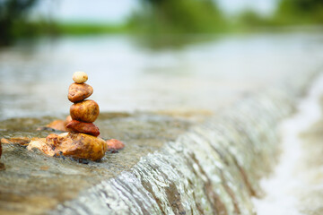 Zen stones over waterfall