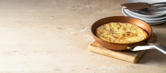  Homemade tortilla, spanish omelette made with eggs and potatoes. Large image for web banner with copy space.