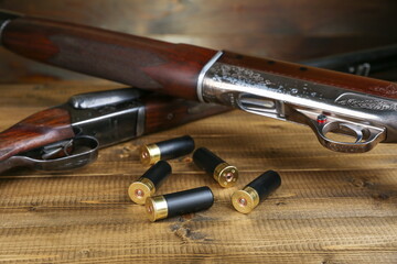 hunting rifles and cartridges are on a wooden background top view studio photo shot