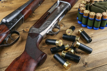 hunting rifles and cartridges are on a wooden background top view studio photo shot