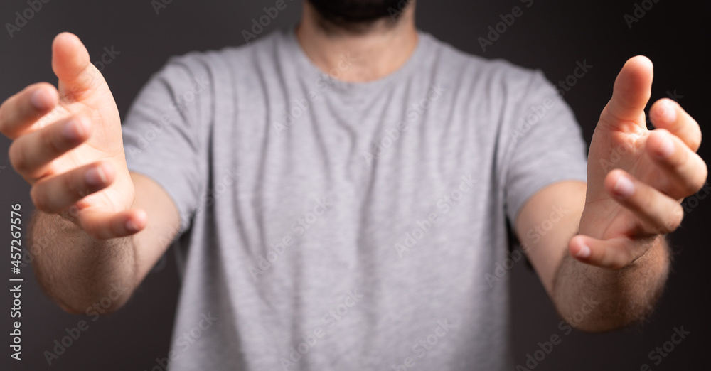 Poster man showing his empty hand.