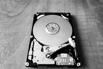 An open laptop hard drive and its internal technological device