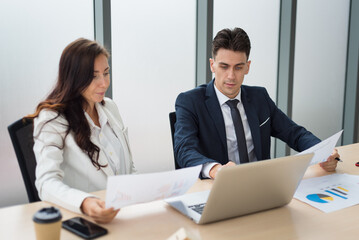 Fototapeta premium Smart business people in formal suit outfit sitting and meeting brainstorming about company investment in modern office room