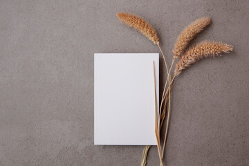 Blank stationary or wedding invite with dried pampas grass stems