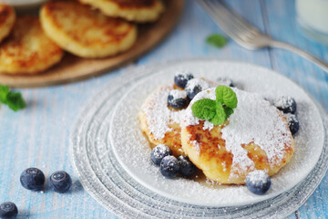 Cottage cheese pancakes - traditional Russian syrniki	