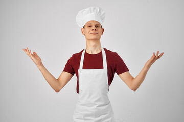 male chef with a cap on his head kitchen work