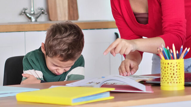 Angry Serious Mum Lecturing Lazy Unmotivated Schoolboy, Children Education Problem, Parent And Child Conflict. Stressed Mother And Son Frustrated Over Failure Homework.