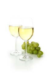 Glasses of wine and grape isolated on white background