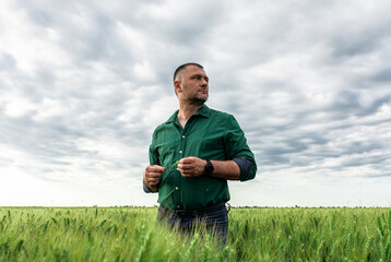 Portrait of farmer standing in wheat field. © Zoran Zeremski