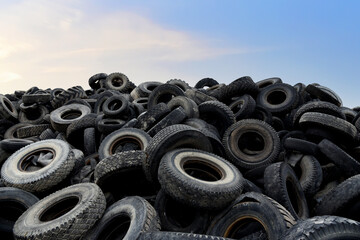 Landfill with old tires and tyres for recycling. Reuse of the waste rubber tyres. Disposal of waste...