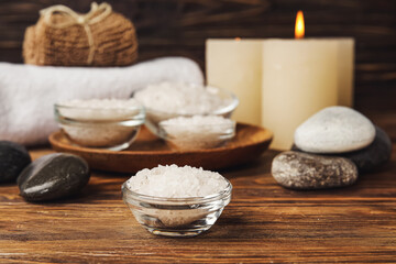 Beautiful spa composition with sea salt on wooden background, closeup