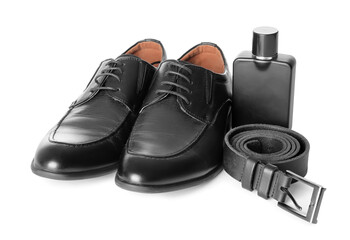 Stylish shoes, belt and perfume on white background