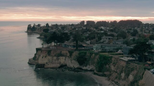 Aerial: Cliffs, residential houses and calm ocean in Capitola, Santa Cruz, USA