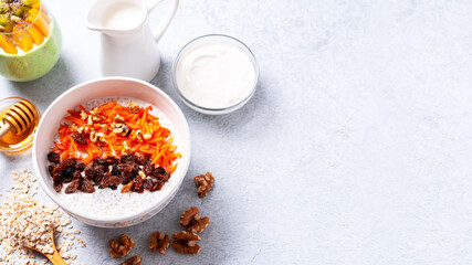 Overnight oats with fruits and nuts on concrete table top