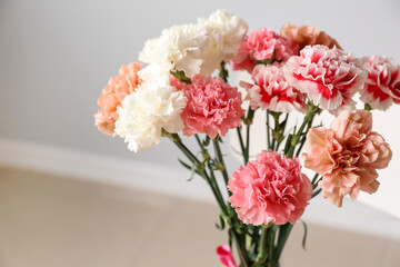 Bouquet of fresh carnations in room